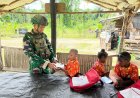 Satgas Marinir Yonif 10 SBY Tebar Semangat Belajar di Perbatasan, Bagikan Buku dan Alat Tulis untuk Anak-anak Kampung Imsun